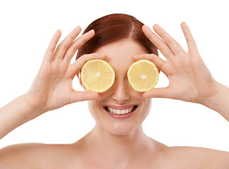 Image showing Woman, skincare and hand with lemon in studio for organic, beauty and hydration benefit on white background. Dermatology, cosmetics and smile with citrus fruit for vitamin c, glow and self care