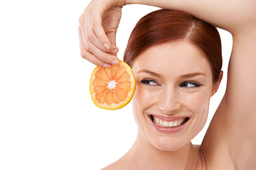 Image showing Studio, orange and woman with smile for skincare with fruit for natural facial, face and white background. Female person, happiness and joy for treatment with food with vitamin c for dermatology