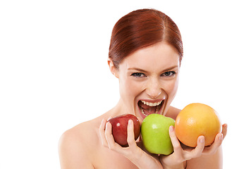 Image showing Woman, portrait and bite fruit in studio or healthy food for lose weight on white background, vegetarian or wellness. Female person, face and apple snack for fibre meal eating, vitamin c or mockup