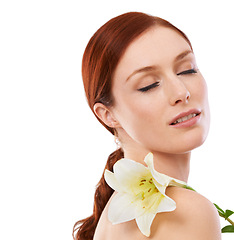 Image showing Beauty, skincare and woman with flower, lily and natural isolated on a white studio background mockup space. Floral cosmetics, organic and model with eyes closed for glow, wellness or facial makeup