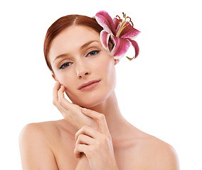 Image showing Beauty, flower and portrait of woman in studio with natural, organic and skincare routine for wellness. Cosmetic, glow and person with floral plant for face dermatology treatment by white background.