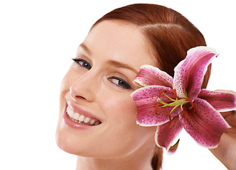 Image showing Skincare, flower and portrait of woman in studio with natural, organic and beauty routine for wellness. Cosmetic, glow and person with floral plant for face dermatology treatment by white background.