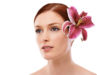 Image showing Skincare, flower and woman in studio with natural, organic and beauty face routine for wellness. Cosmetic, mockup and person with floral plant for facial dermatology treatment by white background.