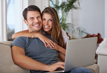 Image showing Portrait, smile and couple with laptop on sofa networking on social media, website or internet. Happy, love and female person embracing husband read online blog with computer in living room at home.