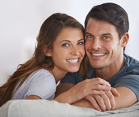 Image showing Happy couple, face and portrait with love in relax on sofa for bonding, holiday or weekend together at home. Young man and woman with smile for support, care or relationship in living room at house