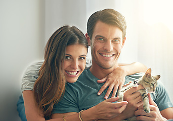 Image showing Man, woman and kitten for portrait in home with hug for love, bonding and care for pet in living room. Couple, relax or pride with kindness, embrace and cat in lounge for animal adoption at house