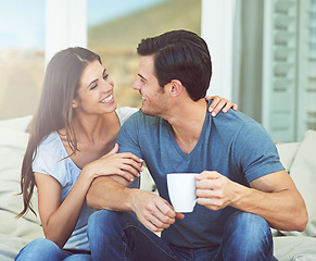 Image showing Coffee, conversation and couple on outdoor sofa for communication, bonding or love on patio in morning. Happy, talking and young man and woman laugh and drinking cappuccino, latte or espresso at home