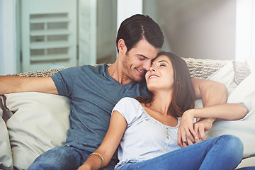 Image showing Love, smile and couple relaxing on sofa by patio cuddling and bonding for marriage at home. Happy, romance and young man and woman resting together on couch by outdoor porch of modern house.