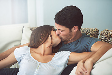 Image showing Love, kissing and couple relaxing on sofa by patio cuddling and bonding for marriage at home. Happy, romance and young man and woman resting together on couch by outdoor porch of modern house.