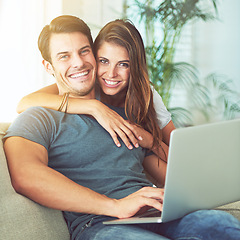 Image showing Laptop, smile and woman embrace man on sofa networking on social media, website or internet. Happy, love and female person hugging husband reading online blog with computer in living room at home.