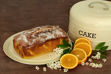 Image showing Orange Drizzle Cake with Fruit and Blossom Flowers