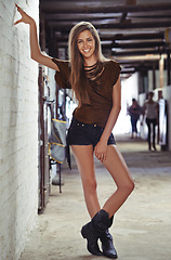 Image showing Portrait, fashion and woman with smile and confident girl with stylish outfit and cool. Face, person and lady with edgy clothes and trendy with fashion and funky with boots and proud