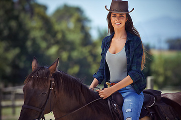 Image showing Woman, portrait and horse or countryside ranch in nature as equestrian for adventure, training or cowboy hat. Female person, saddle and western cowgirl in Texas or farm environment, outdoor or rural