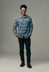 Image showing Happy man, portrait and fashion with style or trendy clothes on a gray studio background. Handsome male person or young model with casual clothing or stylish outfit in confidence on mockup space