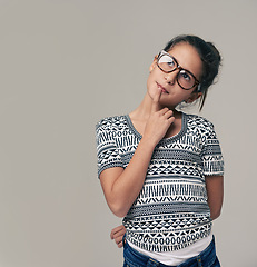 Image showing Girl, face and thinking with fashion for decision, choice or idea on a gray studio background. Female student, child or kid in thought or wonder for memory, reminder or brainstorming on mockup