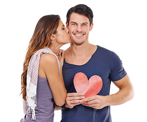 Image showing Portrait, paper and heart with couple, kiss and love isolated on a white studio background. Face, man and woman with cutout and symbol with romance and Valentines day with marriage and relationship