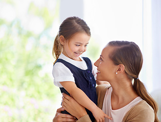 Image showing Mother person, young child and bonding at house, hugging and embracing in family home. Happy, loving and nurturing with affection, smile and single parent or motherhood while sharing sweet moment