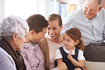 Image showing Parents, grandparents and little girl with happiness on sofa with counting age, bonding and healthy development. Family, men and women or child on couch with smile, confidence and number game in home