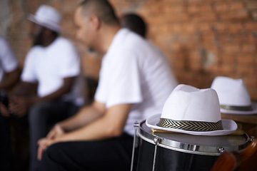 Image showing Band, relax and music with percussion drums on stage, rhythm and men with talent in group. Friends, hats and practice performing in team as professional musician and bonding together for carnival