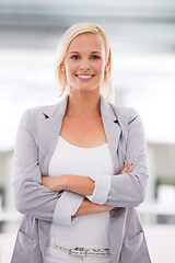 Image showing Employee, portrait and woman with arms crossed, startup and agency with professional and PR consultant. Face, person and entrepreneur with pride and designer in a workplace with business or company