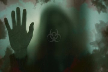 Image showing Indoor, biohazard and person with hand on window with scary, danger or zombie trapped in home. Dark, horror and person with creepy aesthetic from virus, risk and sign on glass warning of toxic threat