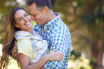 Image showing Couple, portrait and bonding with love in garden together, hug and romance for relationship with commitment. Man, woman and affection for dating with care, happy and spouse for comfort in nature