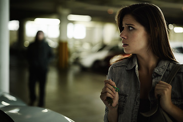 Image showing Female person, suspicious and parking lot with anxiety, worried and stressed for safety and concern. Woman, in danger and scared with backpack, terror and afraid for scary place and living in fear