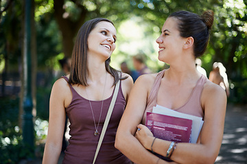 Image showing Students, friends and talking of education on campus with learning, knowledge and books at college. Happy women with outdoor conversation in a park or university for scholarship, study or opportunity