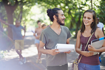 Image showing Students, friends and planning or talking on campus with education, knowledge and notebook or notes at college. Happy people with outdoor conversation in park or university for studying collaboration