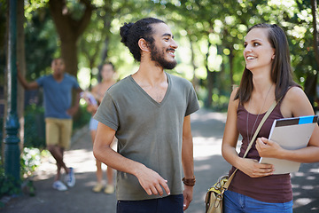 Image showing Students, friends and talking of college on campus for learning, knowledge and happy conversation. Young people laughing, smile and discussion of scholarship, study or education at park or university
