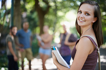 Image showing Portrait, student and woman with smile, campus and outdoor with education and university. Face, person or girl with books or college with knowledge or sunshine with learning or happy with scholarship