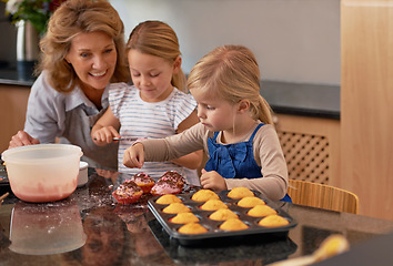 Image showing Granny, children and smile for teaching, baking and bonding together in retirement at home. Happy, senior citizen and girl with cupcake, laugh and icing for creative, family and fun in kitchen