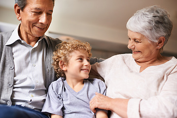 Image showing House, smile and grandparents with grandson in lounge, together and love with happiness. Old people, grandmother and grandpa in home as seniors in retirement, elderly and boy in living room