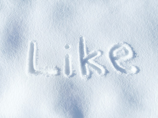 Image showing Like, snow and word in ice outdoor on ground in winter for communication on social media. Writing, sign and drawing on field in nature with frozen background and written sketch for love and care