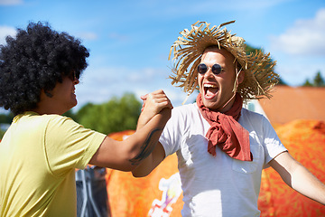 Image showing Outdoor, festival and handshake with friends, men and happiness with celebration and excited. People, park and guys with joy and bonding together with fun and event with a party and weekend break