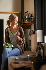Image showing Thinking, woman and eating salad in kitchen at home, nutrition and fresh leafy greens for healthy diet. Food, bowl and hungry person with vegetables, lunch or dream of organic vegan meal for wellness