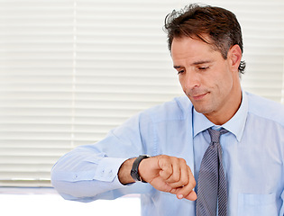 Image showing Businessman, watch and late for office job and appointment or schedule at looking serious. Time, alarm and male person checking calendar for control of clock with anxiety for career compliance