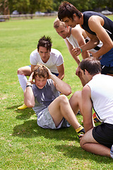 Image showing Man, sit ups for exercise and cheers from team with support and coaching, fitness and training on sports field. Challenge, action and core workout outdoor with athlete friends, motivation and help