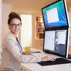 Image showing Portrait, smile and business woman on computer at table in home office for remote work. Face, happy freelancer and creative graphic designer on desktop, glasses and entrepreneur working in Australia