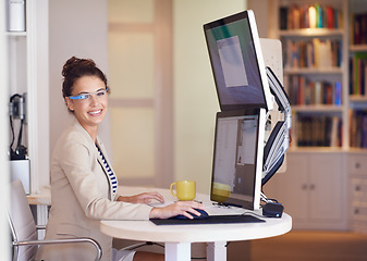 Image showing Happy woman, portrait and smart glasses for business by computer at table in home office. Face, smile and creative graphic designer on desktop with future tech, freelance or remote work in Australia