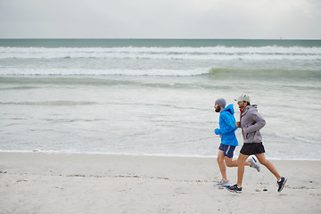 Image showing Ocean waves, men and running on beach, sand and fitness for wellness and gym wear on coast together. Male athletes, jog and training for seaside, health and outdoor for sport and exercise in workout