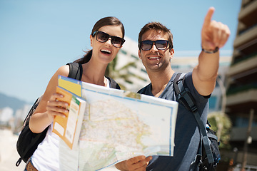 Image showing Couple, map and search with pointing on vacation, street and excited for giving direction. Woman, man and chart for location, landmark and travel for memory with buildings, ocean or nature in Italy