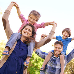 Image showing Smile, nature and children on parents shoulders in outdoor park or field for playing together. Happy, bonding and low angle portrait of mother and father carrying boy kids for fun in garden in Canada