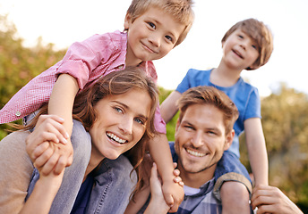 Image showing Happy, nature and children on parents shoulders in outdoor park or field for playing together. Smile, bonding and portrait of young mother and father carrying boy kids for fun in garden in Canada.