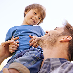 Image showing Family, smile and son on shoulder of father closeup outdoor for love, bonding or fun together. Face, happy or relax with man parent and boy child on sky from below for summer vacation or holiday