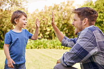 Image showing High five, kid and man in park for family adventure, support and motivation with development. Dad, boy child and happy with excited hand gesture for success, teamwork and happiness together in garden