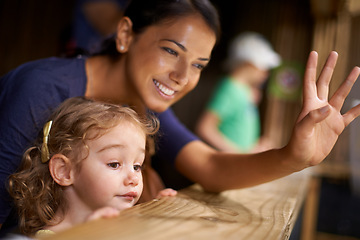 Image showing Smile, mother and child at zoo for bonding, love and weekend fun looking at animals from stable. Mom, daughter and family at farm, nature park and cute for outing and holiday getaway with little girl