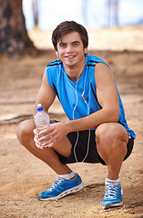 Image showing Portrait, water or happy man on break with earphones in outdoor exercise or fitness workout for podcast. Runner, nature or athlete listening to playlist for streaming radio, music or sports training