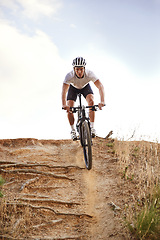 Image showing Portrait, bike and man off road cycling on dirt track for sports, competition or outdoor hobby. Fitness, nature and race with confident young athlete or cyclist in helmet for cardio performance