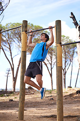 Image showing Park, workout and man on pull up bar with training for morning exercise, wellness or muscle building in San Francisco. Countryside, tree and person with fitness for energy, performance or summer body